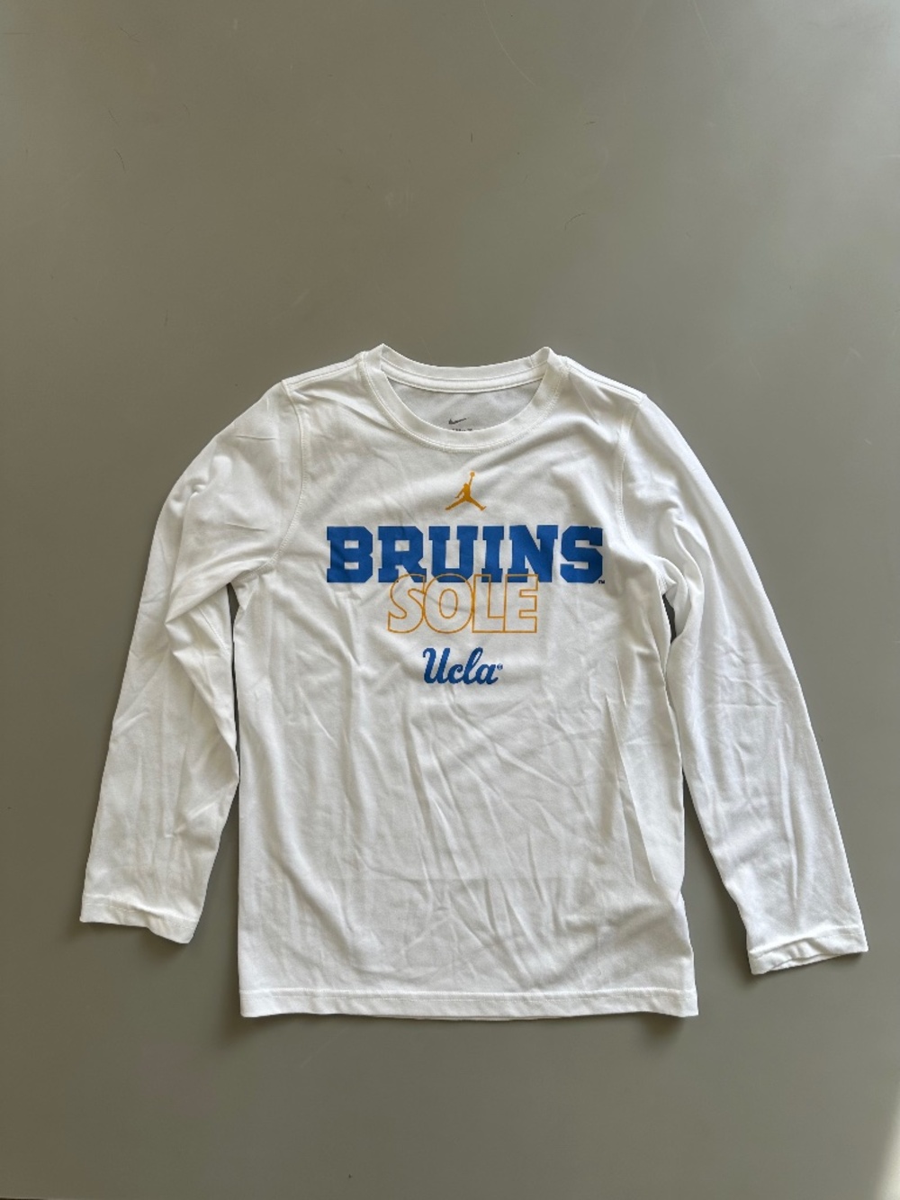 NIKE Youth Jordan UCLA Bruins On Court Sole The Nike Tee Dri-Fit T-Shirt Medium